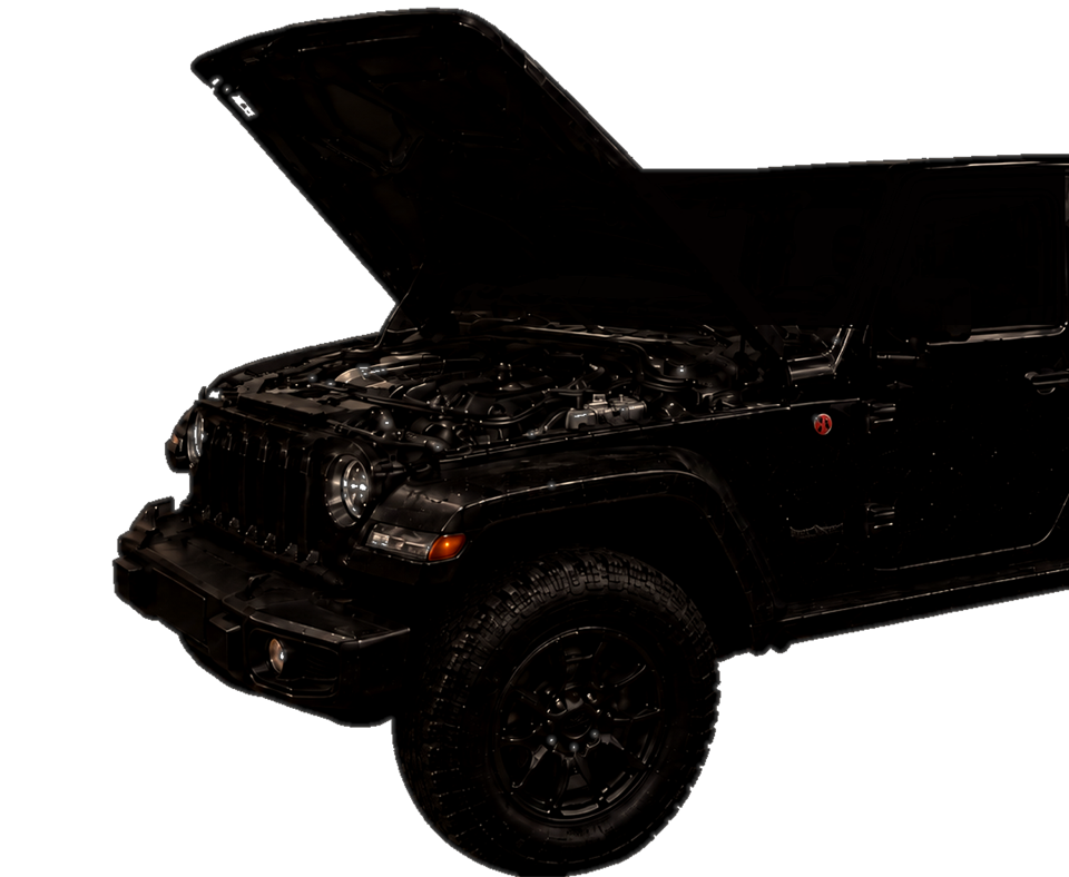 Jeep in the Jay Jones Gear & Auto repair bay at sunset