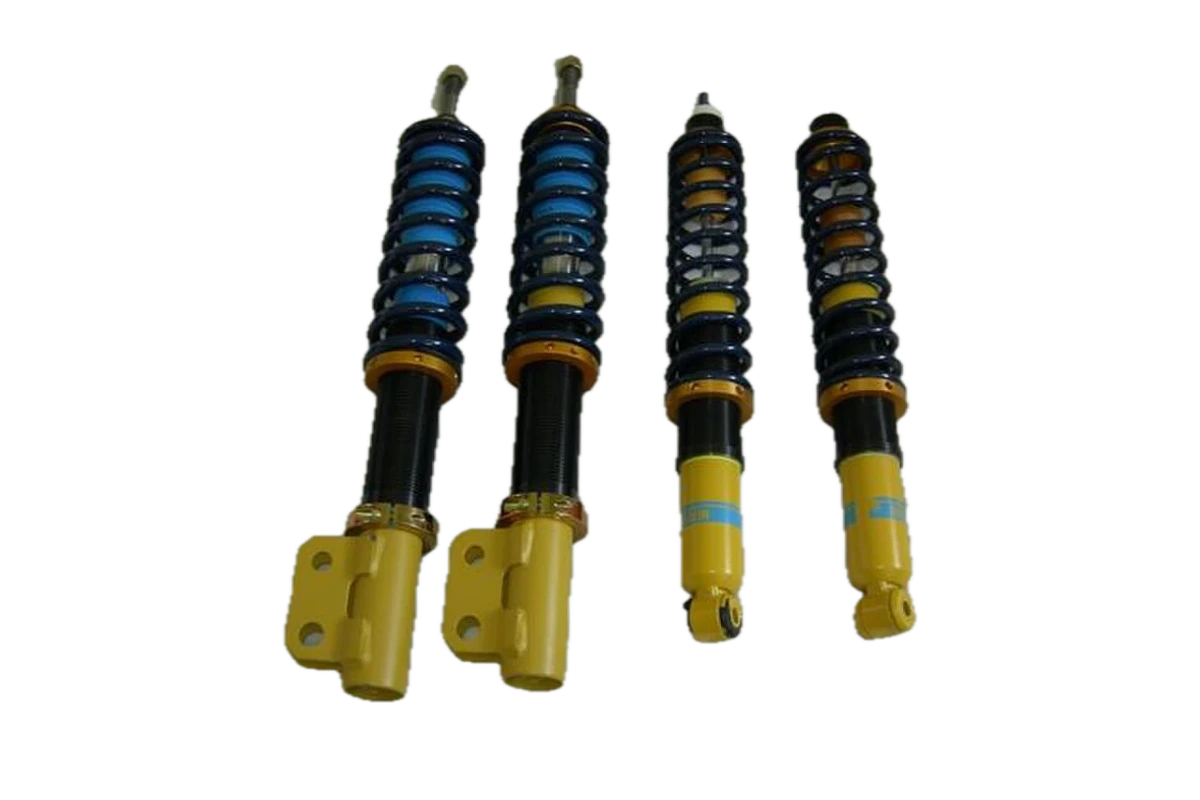 Adjustable automotive coilover suspension components